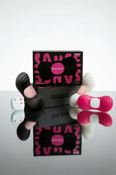 Sauce wearable vibrator, Black, Pink and White with 'Sauce' branding.
